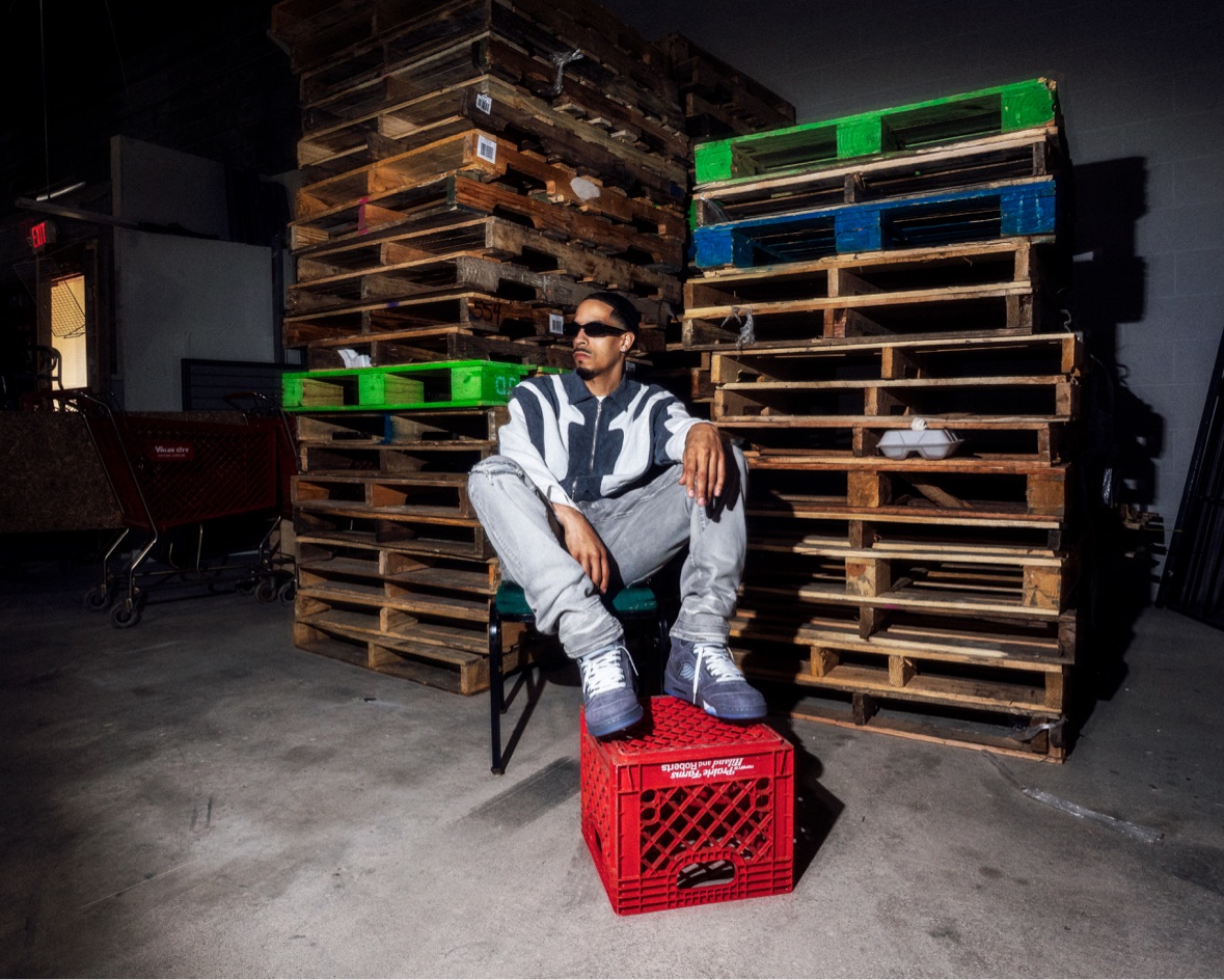 Striped shirt on crate among pallets