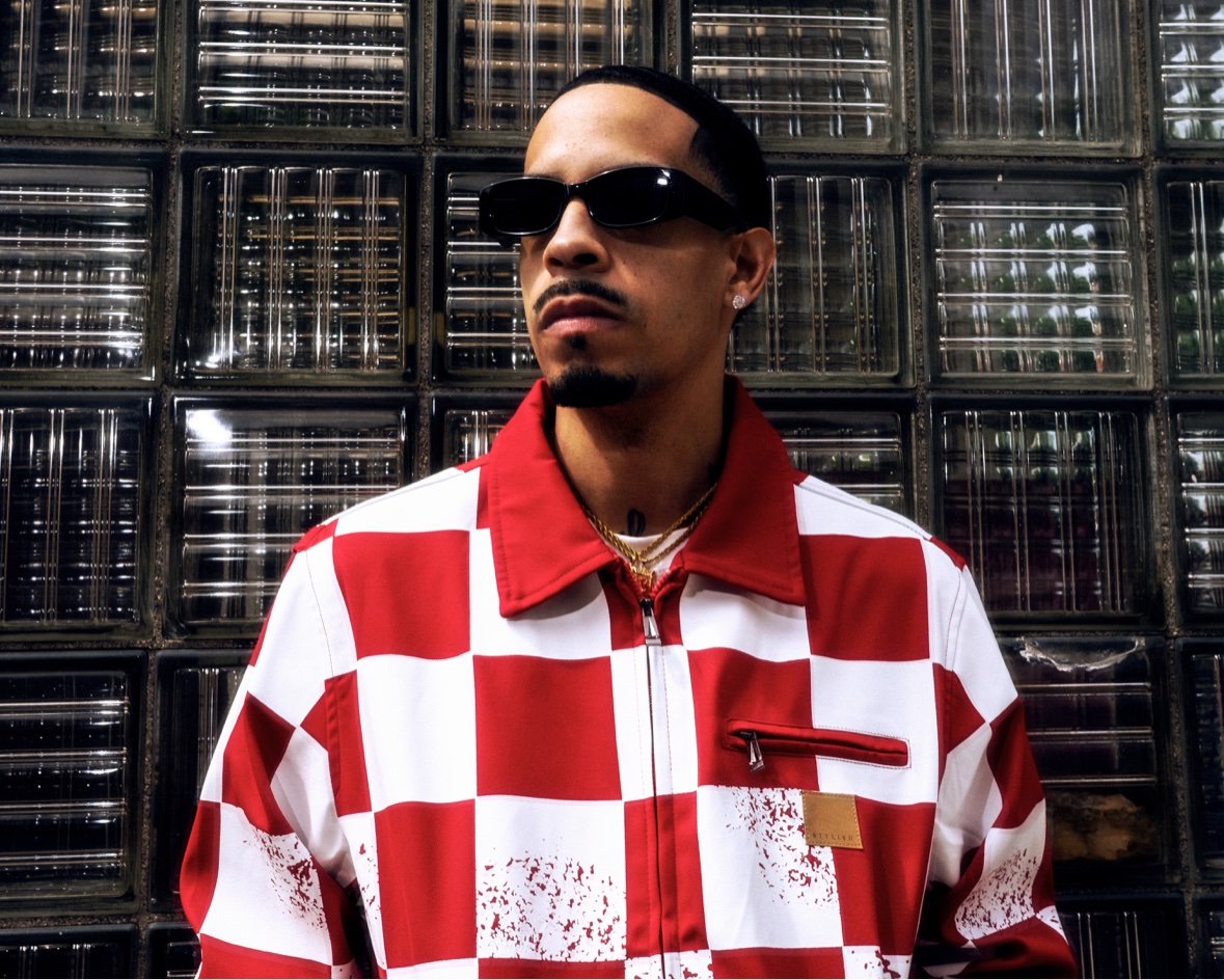 Red checkered shirt close-up against a glass block wall